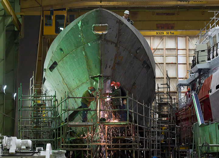 Technicians work on a hull at Halifax Shipyard in Halifax on Thursday, March 7, 2013.