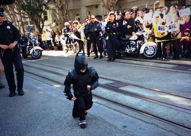Miles Scott, a five-year-old leukemia patient, runs to save a damsel-in-distress as part of his wish to be Batkid for a day. 