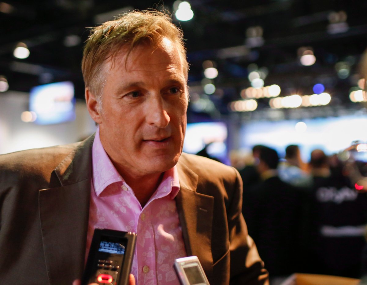 Maxime Bernier, Minister of State for Small Business and Tourism, speaks to reporters at the Conservative convention in Calgary, Saturday, Nov. 2, 2013.