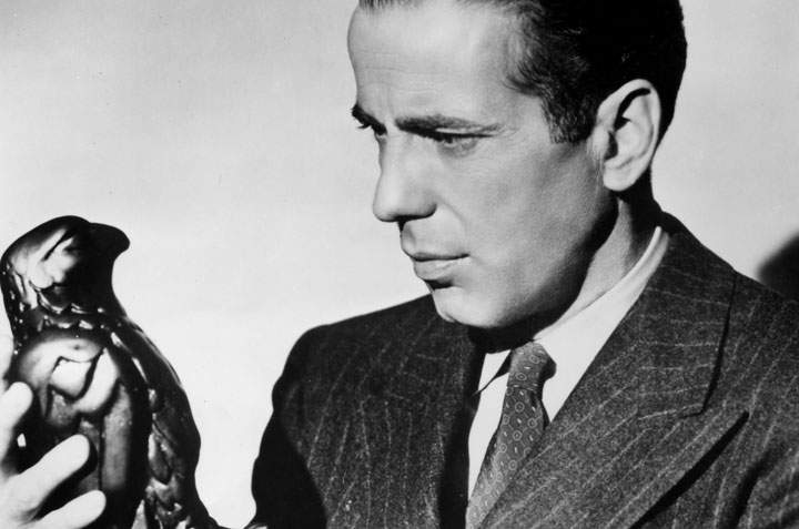 Humphrey Bogart with the statue from 'The Maltese Falcon.'.