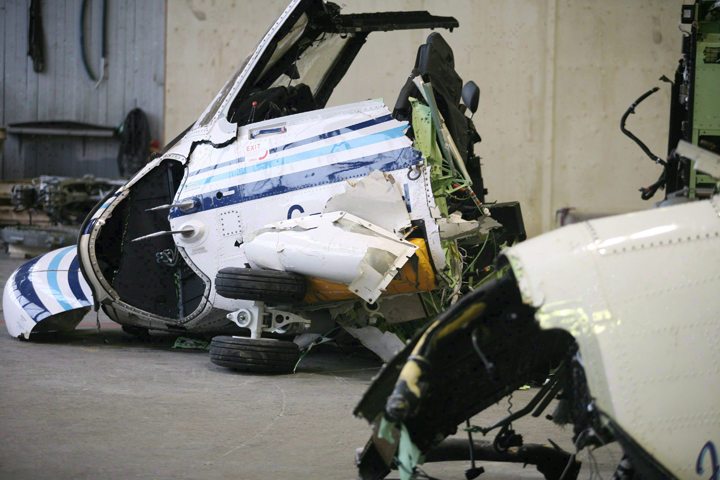 File - The wreckage of the Cougar Helicopter flight 491 displayed to the media as the Transportation Safety Board reports on its findings, in St. John's N.L. on March 26, 2009. 