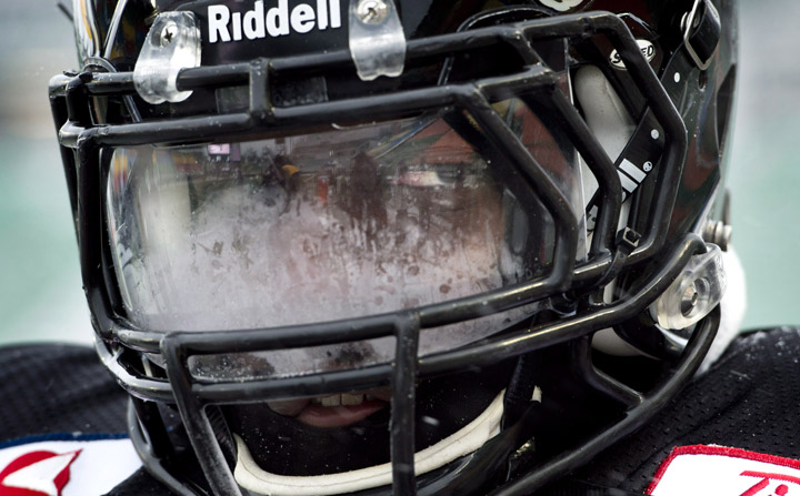 Hamilton Tiger-Cats defensive lineman Brandon Boudreaux peers through a frosted visor during a practice, Wednesday November 20, 2013 in Regina. Several Tiger-Cats suffer frostbite during the frigid practice.