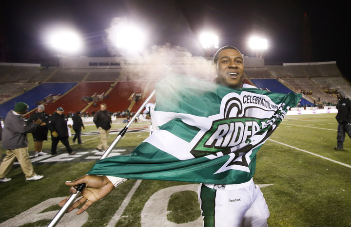 Saskatchewan Roughriders' Kory Sheets celebrates winning the CFL West Final in Calgary, Alta., Sunday, Nov. 17, 2013. The Saskatchewan Roughriders beat the Calgary Stampeders 35-13.
