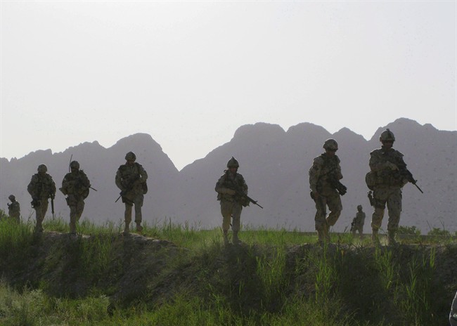 Canadian soldiers patrol an area in the Dand district of southern Afghanistan on Sunday, June 7, 2009.