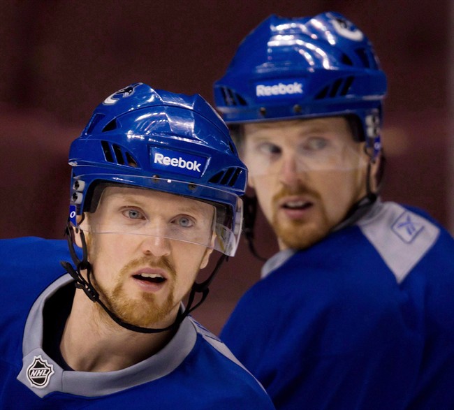 Daniel and Henrik Sedin are pictured in Vancouver on April 12, 2011.