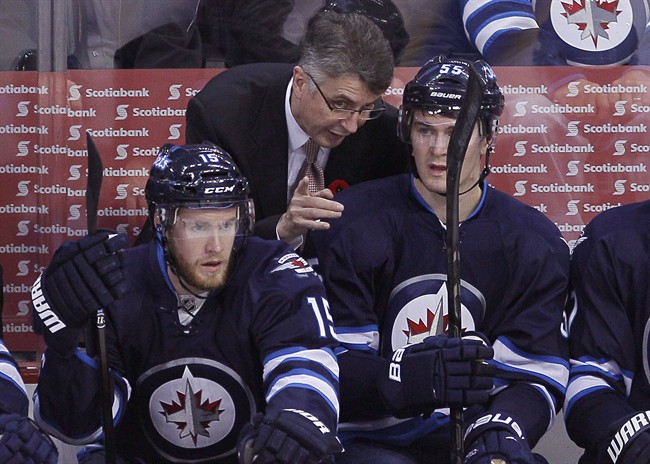 Winnipeg Jets' head coach Claude Noel talks to Mark Scheifele (55) at a game in Winnipeg on Nov. 4. Noel says he has faith the worst power play in the league will improve.