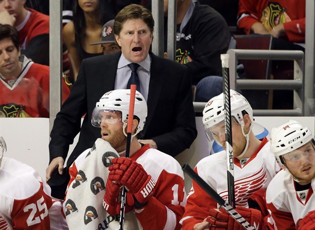 Detroit Red Wings head coach Mike Babcock, top, yells his team during the first period of Game 1 of an NHL hockey playoffs Western Conference semifinal against the Chicago Blackhawks in Chicago, Wednesday, May 15, 2013.