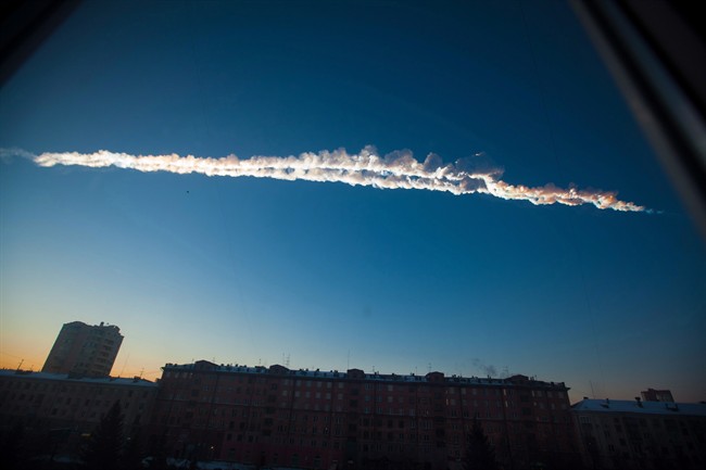 The Chelyabinsk meteor burns up over Russia.