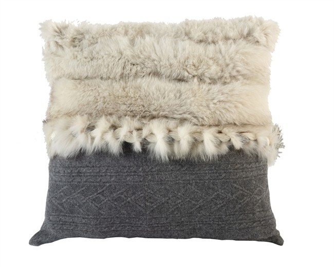 A pillow constructed from recycled Norwegian fox, recycled grey sweater knit and distressed graphite leather ($399) from the Harricana for Mobilia collection is seen in this undated handout photo. The pillow features a removable braid that can be worn as a scarf of accessory. 