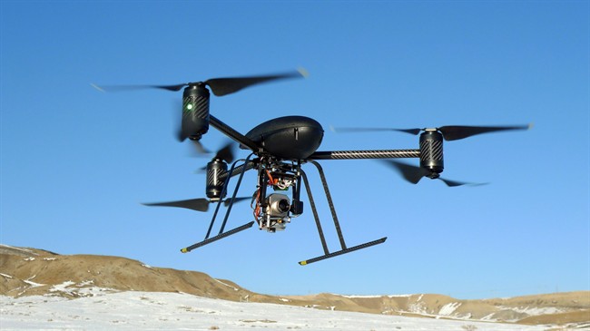 A small Draganflyer X6 drone is photographed during a test flight in Mesa County, Colo.,in a Jan.8, 2009 file photo. 