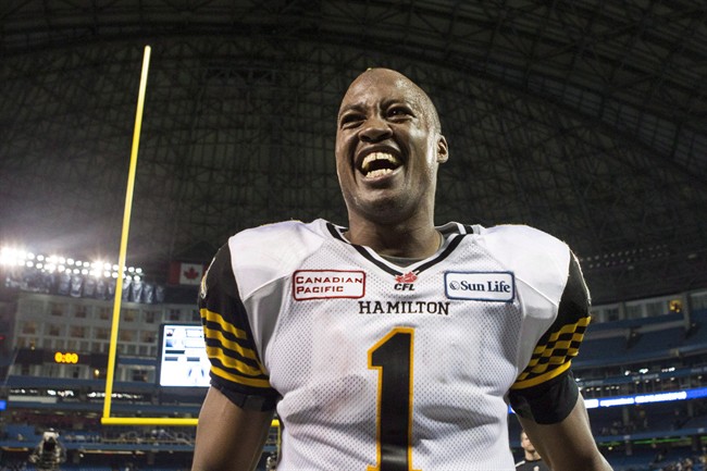 Hamilton Tiger-Cats quarterback Henry Burris celebrates after beating Toronto Argonauts 36-24 to win the CFL eastern conference final in Toronto on Sunday November 17 , 2013. 