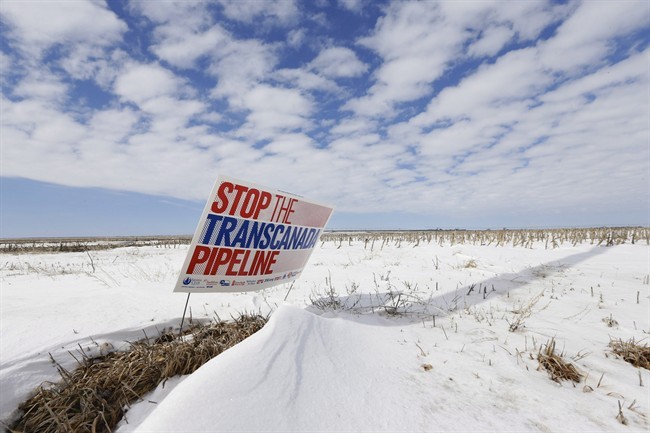 In this photo taken on March 11, 2013, a sign reading "Stop the Transcanada Pipeline" stands in a field near Bradshaw, Neb.