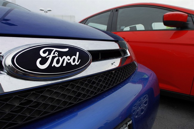 In a July 1, 2012 photo, the Ford logo is seen on cars for sale at a Ford dealership in Springfield, Ill. 