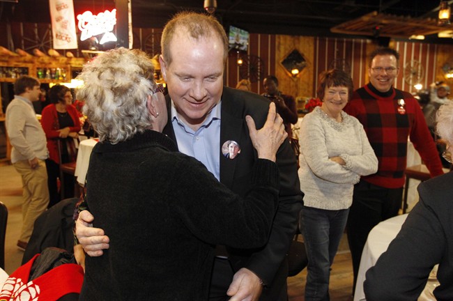 Liberal candidate Rolf Dinsdale greets supporters at his party during a tight byelection in the Brandon-Souris area in Brandon, Man., Monday, Nov. 25, 2013. 