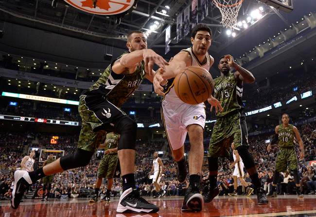 Utah Jazz centre Enes Kanter, 0, battles Toronto Raptors centre Jonas Valanciunas, 17, for the ball during first half NBA action in Toronto on Saturday November 9, 2013. THE CANADIAN PRESS/Frank Gunn.