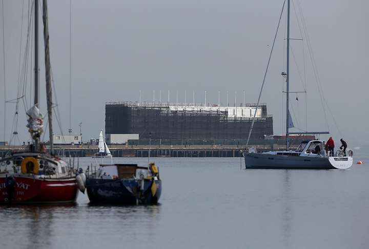 A barge under construction is docked at a pier on Treasure Island on October 30, 2013 in San Francisco, California. Mystery barges with construction of shipping containers have appeared in San Francisco and Portland, Maine, prompting online rumors that the barges are affiliated with a Google project. 