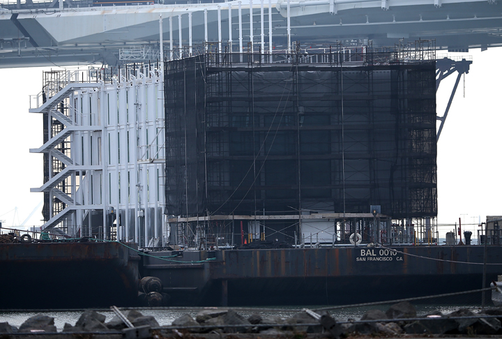 A barge under construction is docked at a pier on Treasure Island on October 30, 2013 in San Francisco, California. Mystery barges with construction of shipping containers have appeared in San Francisco and Portland, Maine, prompting online rumors that the barges are affiliated with a Google project. 
