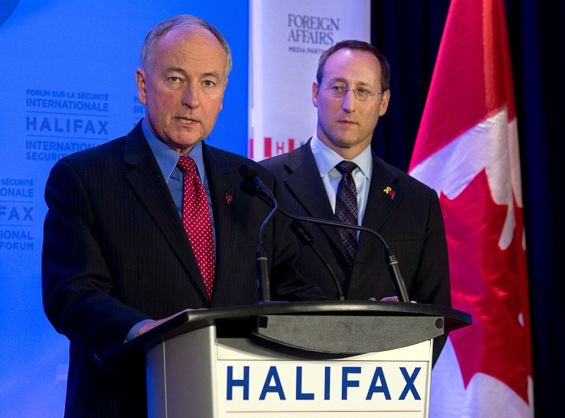 Canadian Defence Minister Rob Nicholson, left, and Justice Minister Peter MacKay attend the closing news conference of the Halifax International Security Forum in Halifax on Sunday, Nov. 24, 2013. THE CANADIAN PRESS/Andrew Vaughan.