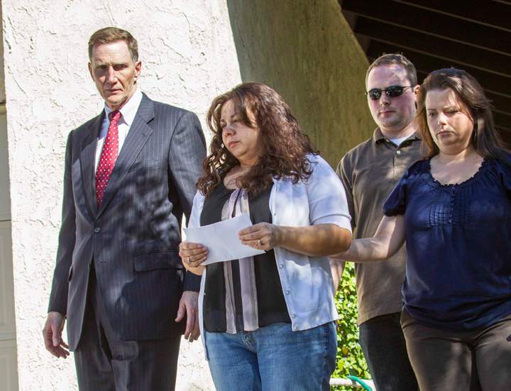John S. Pistole, left, Administrator of Transportation Security Administration and Ana Hernandez, center, wife of TSA agent Gerardo Hernandez, victim at LAX shooting, before a press conference in Porter Ranch, Calif. on Saturday Nov. 2, 2013. A gunman armed with a semi-automatic rifle opened fire at Los Angeles International Airport on Friday, killing a Transportation Security Administration employee and wounding two other people in an attack that frightened passengers and disrupted flights nationwide (Photo credit: AP Photo)