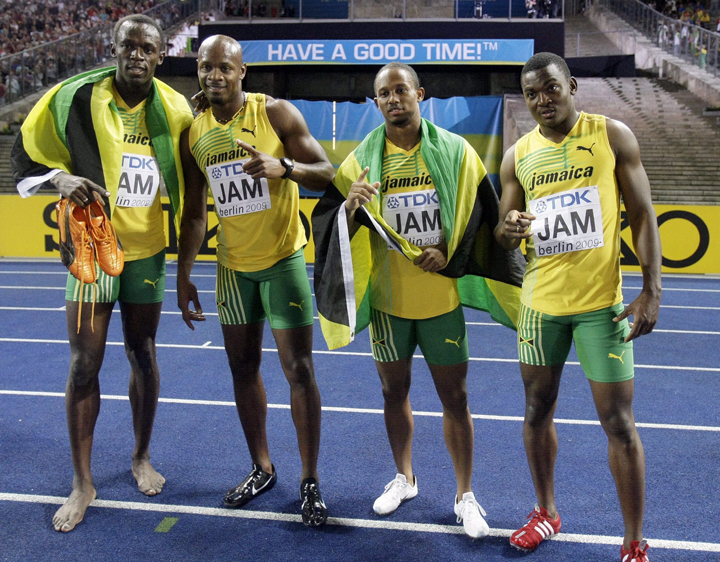 FILE - In this Aug. 22, 2009 file photo, Jamaica's sprinters, from left, Usain Bolt, Asafa Powell, Michael Frater and Steve Mullings celebrate winning gold in the Men's 4x100m final during the World Athletics Championships in Berlin, Germany.