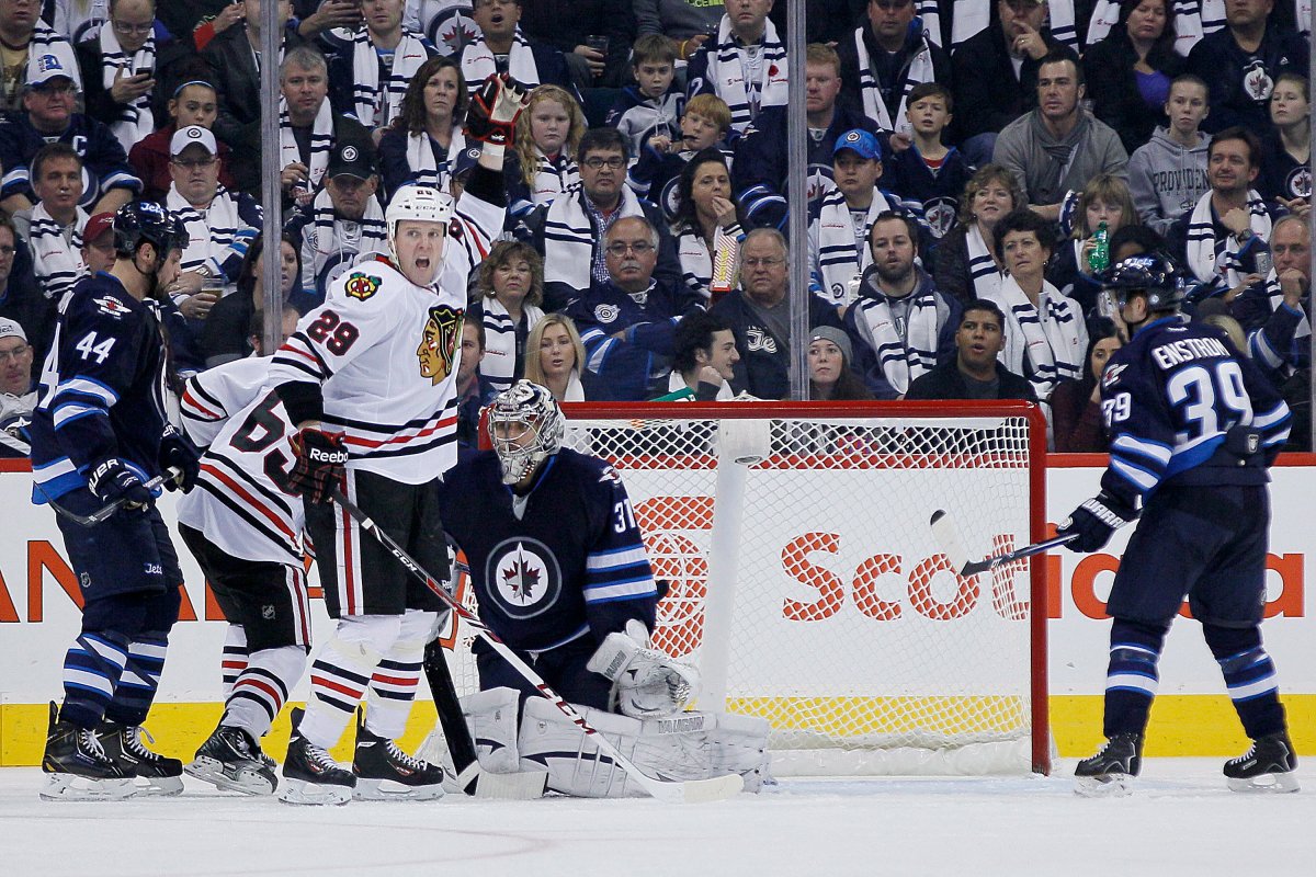 Chicago Blackhawks' Bryan Bickell (29) celebrates Nick Leddy's (8) goal against the Winnipeg Jets during second period NHL action in Winnipeg on Saturday, November 2, 2013. 