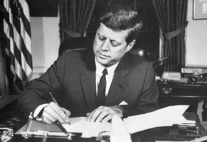 US President John Fitzgerald Kennedy signs the order of naval blockade of Cuba, on October 24, 1962 in White House, Washington DC, during the Cuban missiles crisis.