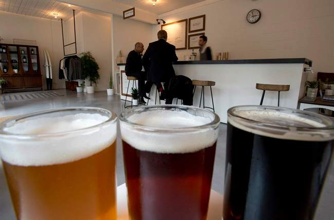 Patrons sit at the 33 Acres Brewing Co. tasting lounge.