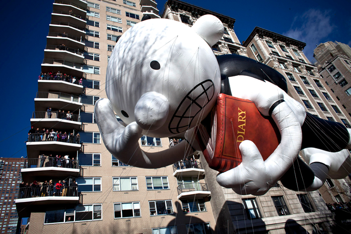 The Uncle Sam balloon floats above the street during the Macy’s Thanksgiving Day Parade on November 28, 2013 in New York City. Despite earlier concerns about the wind, the balloons flew as planned for the parade. (Photo credit: Getty Images)