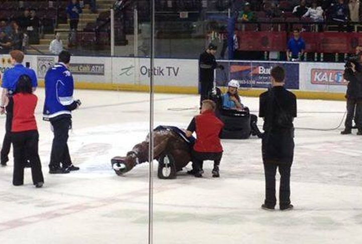An official helps Marty the Marmot after he was body slammed by what appeared to be a disgruntled fan on Nov. 2. 
