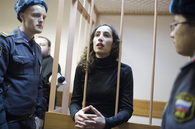 Greenpeace International activist Faiza Oulahsen speaks from inside a barred enclosure at a courtroom during a hearing that is considering the investigators' request to extend the detention of 30 members of the Arctic Sunrise Greenpeace International ship in St.Petersburg, Russia, Wednesday, Nov. 20, 2013. 