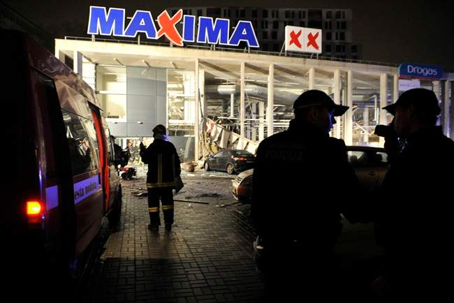Rescuers work at the Maxima grocery store after its roof collapsed in Riga, Latvia, Thursday, Nov. 21, 2013. 