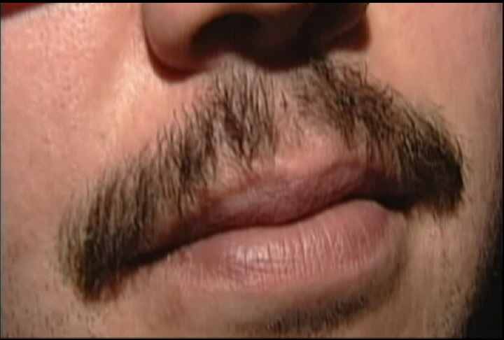 A man with an in-progress moustache.