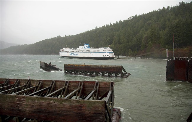 The ferry Queen of Nanaimo sits in shallow water on Saturday Nov. 2, 2013 at Village Bay, B.C. after high winds knocked the vessel out of position at it was departing the terminal. THE CANADIAN PRESS/Sue Kendall.