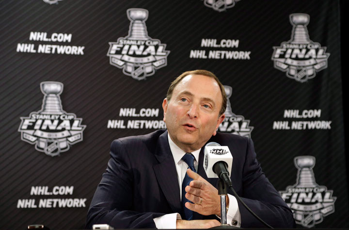 In this June 12, 2013, file photo, NHL Commissioner Gary Bettman speaks during an NHL hockey news conference in Chicago. NHL Commissioner Gary Bettman declined to comment on the impact of the NFL football concussions lawsuit last month, but he said the league has been proactive for decades in addressing head injuries. (AP Photo/Nam Y. Huh, File).