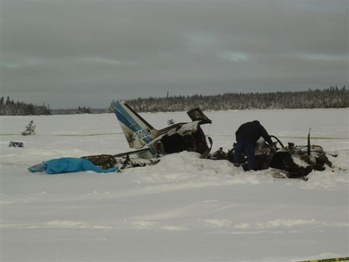 The wreck of a small plane lies on the ice at North Spirit Lake, Ont., in January 2013.