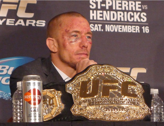 Welterweight champion Georges St-Pierre attends a post-fight news conference in Las Vegas, Nev., Saturday, Nov.16, 2013.