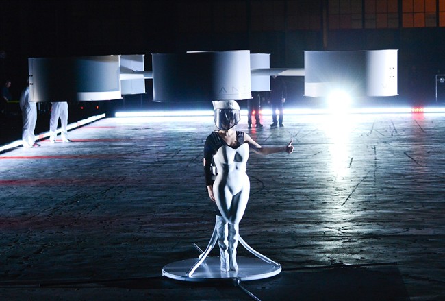 Lady Gaga demonstrates the Volantis transport prototype "flying dress" designed by TechHaus - Studio XO during the ARTPOP album release and artRave event.