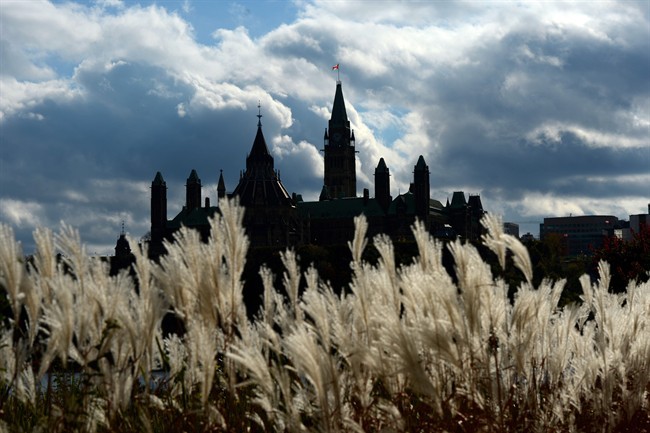 Parliament Hill in Ottawa is viewed from the shores of Gatineau, Quebec on Tuesday, Oct. 22, 2013. 