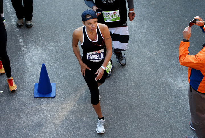 Pamela Anderson crosses the finish line of the NYC Marathon on Nov. 3, 2013.