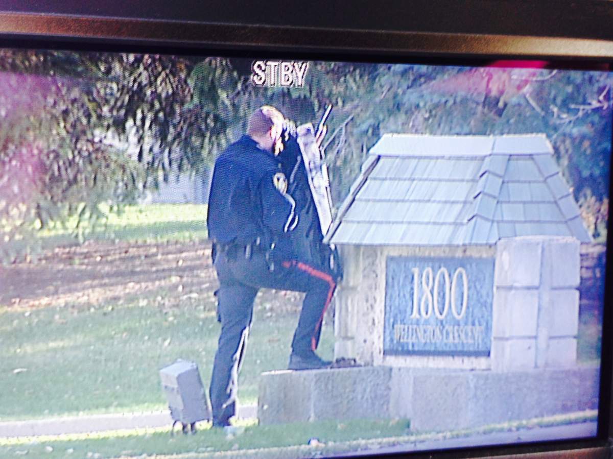 Winnipeg police surrounded a home on Wellington Crescent Friday afternoon, after being called to check on the well-being of  "a distraught man.".
