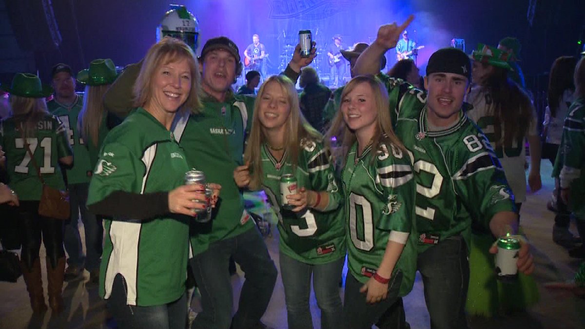 Rider fans enjoying a beverage in Riderville during Grey Cup 101.