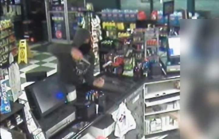 A still from surveillance video of convenience store robbery.