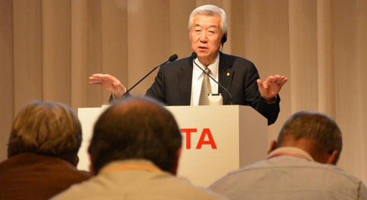 Toyota executive Vice President and head of research and development Mitsuhisa Kato speaking to reporters in Tokuo, November 21, 2013. 