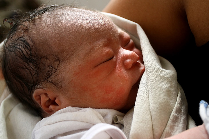 Baby Beatriz Joy is born at a makeshift medical center in the storm damaged central Philippine city of Tacloban on November 11, 2013. (Photo credit: Getty Images). Read the latest on Typhoon Haiyan here.