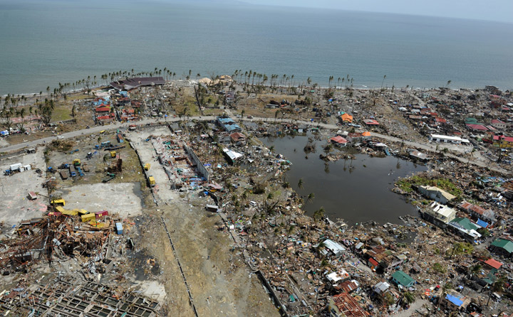 This aerial photo shows destroyed houses in the city of Tacloban, Leyte province, in the central Philippines on November 11, 2013, only days after Super Typhoon Haiyan devastated the town on November 8.