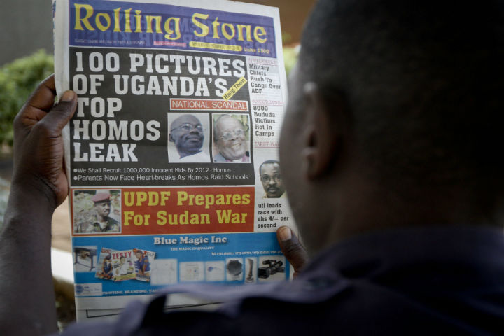 A Ugandan man reads the headline of the Ugandan tabloid newspaper "Rolling Stone" in Kampala, Uganda. Tuesday, Oct. 19, 2010, in which the papers reveals the identity of allegedly gay members of Ugandan society and calls for public punishment against those individuals. (File/AP Photo).