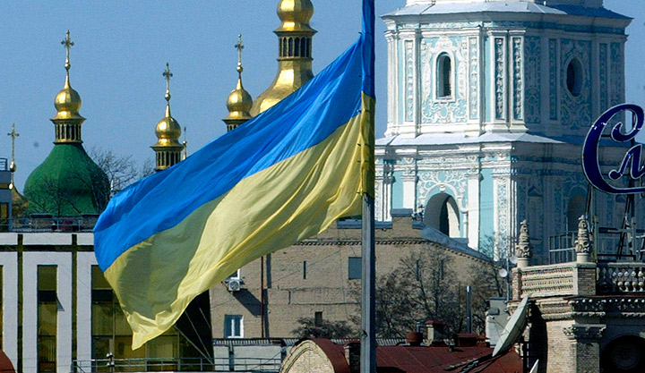 The Ukrainian national yellow-and blue flag waves against the St.Sofia Cathedral in Ukraine's capital Kiev. The Ukrainian city of Lviv has submitted its bid to host the 2022 Winter Olympics.