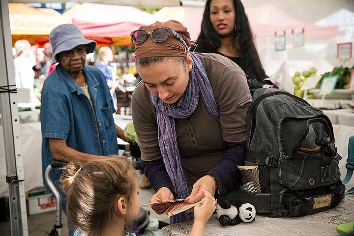 A woman and her daughter counts out Electronic Benefits Transfer (EBT) coupons, more commonly known as Food Stamps, while shoping for groceries in the GrowNYC Greenmarket in Union Square on September 18, 2013 in New York City. 