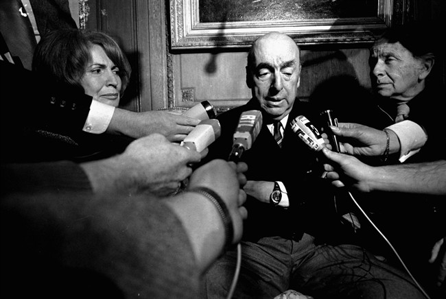 This Oct. 21, 1971 file photo shows Pablo Neruda, poet and then Chilean ambassador to France, talking with reporters in Paris after being named the 1971 Nobel Prize for Literature.