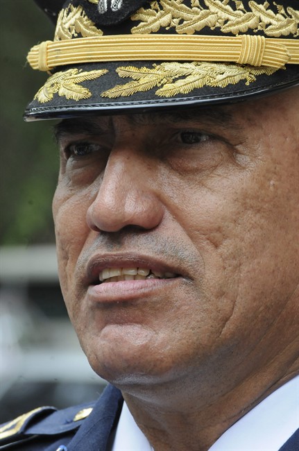 In this July 24, 2013 photo, Honduras Police Chief, Gen. Juan Carlos Bonilla, speaks to the press in Tegucigalpa, Honduras. The five-star general was accused a decade ago of running deaths squads and today oversees a department suspected of beating, killing and “disappearing” its detainees. 